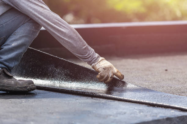 Professional Waterproofing technician working in Lawrence, KS